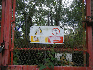 Warning signs on a red door
