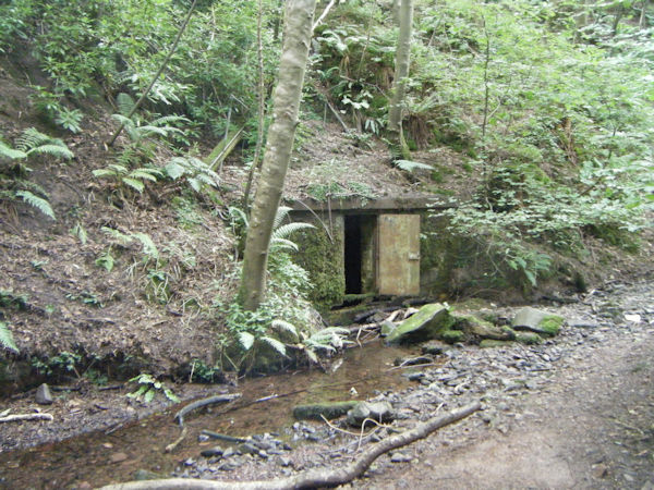 a stone building in a hillside