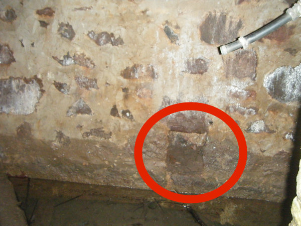 a stone wall with a small niche